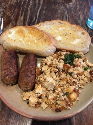 Homemade sausages and scrambled tofu with sourdough toast and vegan butter.  at The Good Apple Cafe in Sunderland