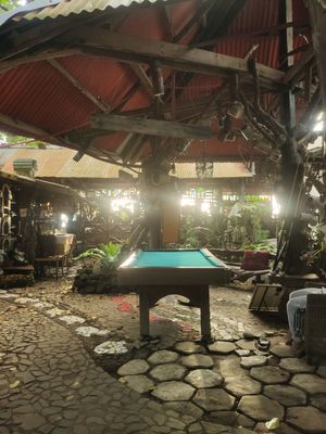 Pool area at The BeeHive Driftwood Cafe in Camiguin