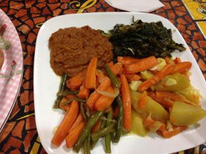 Main plate has: Gomen dish, Yatkilt dish, Fasolia dish, & a Greenbean dish
 at Azla Vegan in Los Angeles