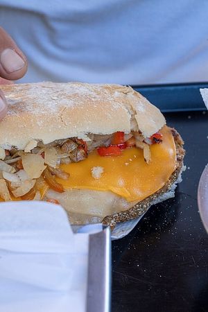 Milanesa vegana con quesos cheddar y dambo   at El Puestito del Tío in Buenos Aires