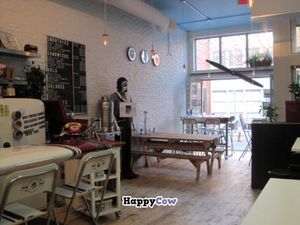 View of the aircraft décor of Propulsion. The counter on the left is an airplane wing. at Propulsion Vegan Canteen in Montreal