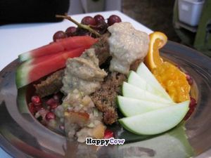 Dessert plate with different cakes, frostings, fresh fruits and fruit chutney at Propulsion Vegan Canteen in Montreal