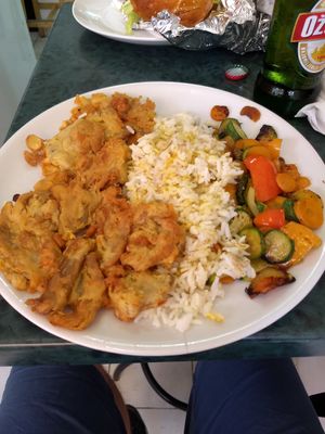 Mushrooms fried with chickpea flour , with rice and vegetables at Vege Fast Food in Split