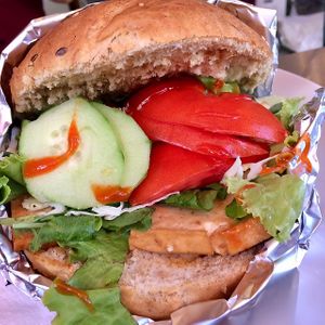 Vegan tofu-burger...there is no sauce on the burger, but there are different sauces standing around to put on it (siracha, ketchup...) at Vege Fast Food in Split