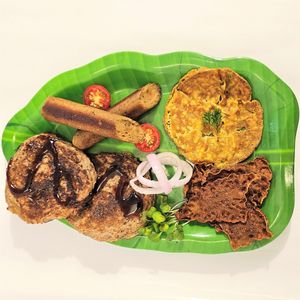 American Flag Breakfast includes gluten-free pancakes, omelette, crispy bacon and country sausage - all plant based at Karma Kitchen in Siolim