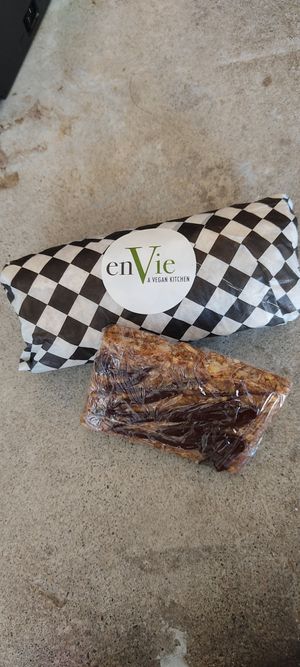 Wrap de couve e barrinha de cereal com chocolate deliciosa. at enVie A Vegan Kitchen in Halifax