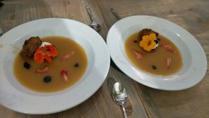 Sticky toffee pudding with edible flowers at enVie A Vegan Kitchen in Halifax