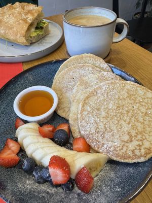 Pancakes with fruit and golden syrupp  at Rolling Oats in London