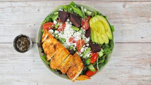 green salad with chicken at Whole Green Cafe in Pompano Beach