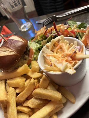 Plant based burger (Moving Mountains?) vegan slaw, healthy portion of chips and an excellent salad with a fantastic mustard dressing    at The Station Inn in Carnforth