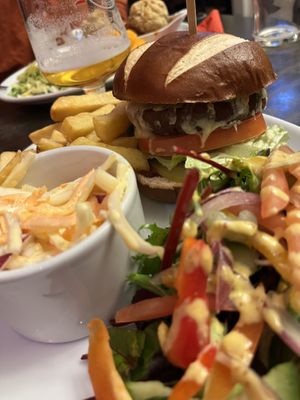 Plant based burger, coleslaw, chips and salad    at The Station Inn in Carnforth