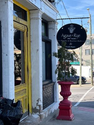 big yellow entry door at Agave & Rye in Louisville
