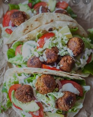 falafel tacos with lettuce , diced tomato/onion mixed and your choice of sauce ( hummus or eggplant) at Eat Like A Greek  in Edgewood