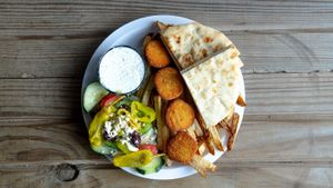 Vegan nuggets platter with your choice of side (rice , veggies , or fresh cut fries) with your choice of sauce ( hummus or eggplant)side of salad and a pita bread! at Eat Like A Greek  in Edgewood