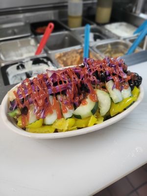 Vegan nuggets rice bowl with lettuce, diced tomato/onion cucumbers ,banana peppers , green peppers, red cabbage and your choice of sauce!(hummus or eggplant) at Eat Like A Greek  in Edgewood