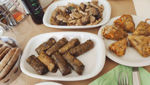 Stuffed zucchini flowers, dolmades, marinated mushrooms and handmade pitta bread at Glossitses in Crete