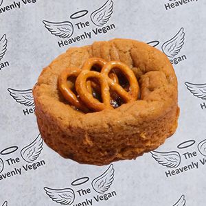 Elevate your snacking game with our irresistible Salted Caramel Pretzel cookie. This delectable treat features a rich dark choc chunk cookie stuffed with salted caramel at Heavenly Vegan Coffi in Barry