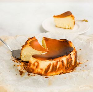 Indulge in the ultimate guilt-free treat with our Basque Vegan Cheesecake. Made with love and 100% plant-based ingredients, this dessert will have you coming back for more. at Heavenly Vegan Coffi in Barry