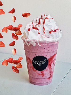 Indulge in the creamy goodness of our Strawberry Milkshake, the perfect treat to cool off and embrace that Summer feeling. Made with strawberries and plant based milk, classic. at Heavenly Vegan Coffi in Barry