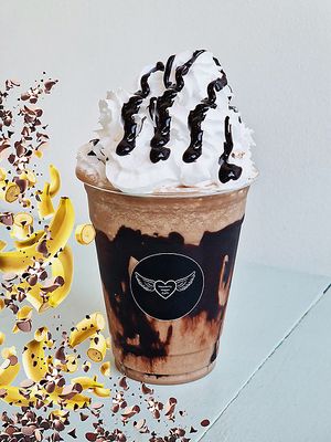 Get ready to indulge in the ultimate chocolate and banana milkshake! When you need a boost of energy with a touch of decadence, this delicious drink is the perfect pick-me-up. at Heavenly Vegan Coffi in Barry