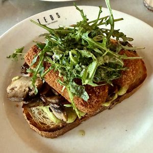 Croquettes on sourdough with mustard, avocado, mushrooms and topped with rocket  at Teds Eindhoven in Eindhoven