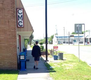nondescript storefront - look for the 'CMC' sign at Radical Press Coffee Collective in Gainesville