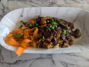 Vegan Liberian Jollof Rice with eggplant and fried plantains at Legacy Village West African Cuisine in Muncie