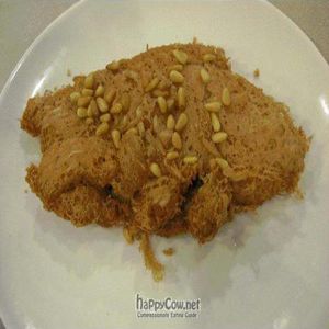 Taro fish is an entree of seasoned taro paste formed in a mold, sprinkled with pine nuts. Good, flavorful, and filling. at The Original Buddha Bodai - Kosher Vegetarian Restaurant in New York City