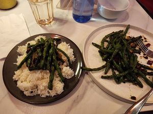 A smoky green bean dish with burnt garlic and dry chili bits... simple but to die for at The Corner in New York City