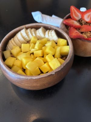 PEANUT BOMBA BOWL
Acai topped with homemade peanut butter, homemade walnut granola, mango, and banana (peanut butter is under the fruit)  at Projeto Acai - SZR  in Dubai