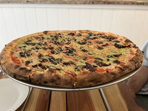 Vegan pizza with pesto   at Back Bench Pizza in Ventura