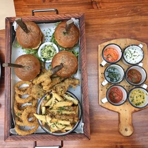 Plate for 4: burgers, onion rings, fries, fried portobello mushrooms, various dips at Green Point in Cusco