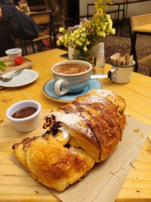 breakfast: chocolate croissant with hot chocolate at Green Point in Cusco