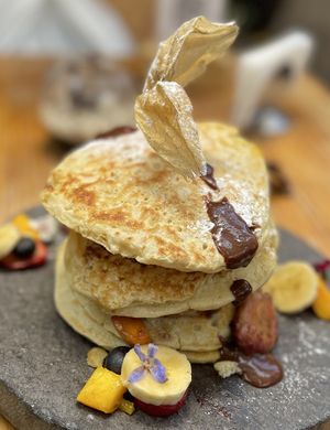 Their pancakes 😍! A stack so nice and high it can be shared, but why?  at Green Point in Cusco