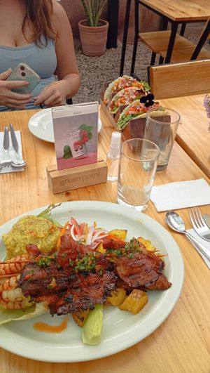 Grillplatter and Tacos in the background at Green Point in Cusco