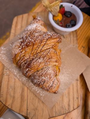 Breakfast sweet croissant - full of fruit! at Green Point in Cusco