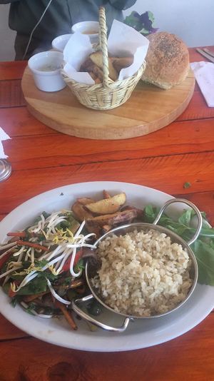 Peruvian stir fly! My friend got the burger! at Green Point in Cusco