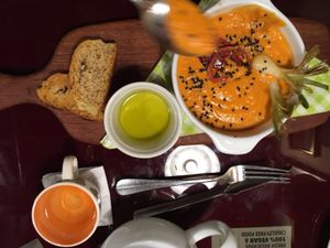 Creamy tomato soup with bread and olive oil. No dairy! at Green Point in Cusco