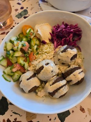This falafel on rice was tasty and delicious as well as the Hummus, Salad, & Pickled Cabbage.  Nice restaurant with parking and plenty of seating.  Great options for vegans here. at Shuk Savannah in Savannah