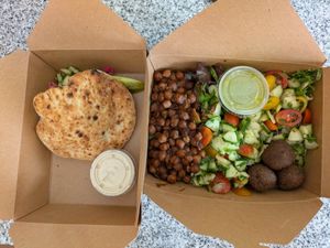 Falafel Pita and Mediterranean Cobb Salad. Both easily modified to be vegan. at Shuk Savannah in Savannah