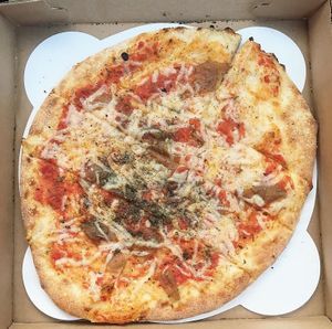 vegan cheese, organic tomato sauce, homemade garlic oil, organic herbs and organic caramelized onions  at Flatbread Company in North Conway
