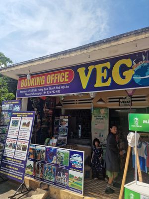 Big blue sign shared with another business at Rose's Family Vegan Shop - Vegan Grocery, Vegan Icecream and Healthy Kombucha in Hoi An