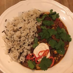 Spicy beans and rice with sour cream at Plevel in Prague