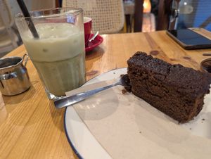 Matcha oat iced latte and vegan ginger cake at Reunion Deli in Belper