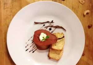 Poached pear with vanilla, creme fraiche and italian lemon bread. Served with La Boheme coffee. at Estrella in Prague