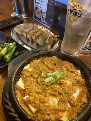 Mapo Tofu, Gyoza and pickles.  at The original Shinshu gyoza Tsukumo Yokocho - 元祖信州餃子 ツクモ横丁 in Nagano