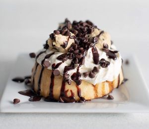 Cookie Monster! Cream Cheese Frosting, Chocolate Chip Cookie Dough, Chocolate Chips, and Chocolate Sauce! at Cinnaholic in Ankeny