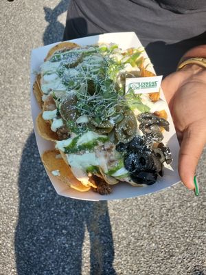 Loaded nachos 😋 at Madrina Vegana in Astoria