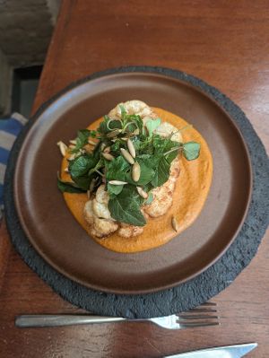 Roasted Cauliflower, Red Vegan Pipián, Huauzontle, Roasted Pepitas.  at Los Danzantes Oaxaca in Oaxaca