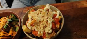 Patatas Bravas, potaoes, red sauce, garlic, fried garlic at Les Tontons Veg - Paradis in Paris